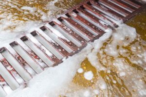 floor drains in a food business getting cleaned